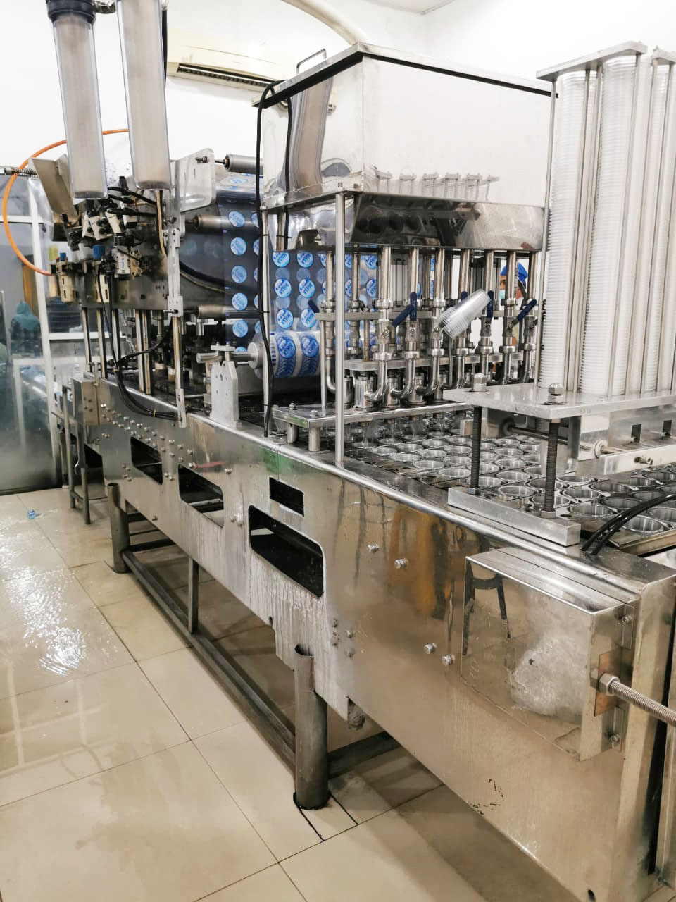 Mesin cup filling AGUEN — produksi air minum kemasan gelas